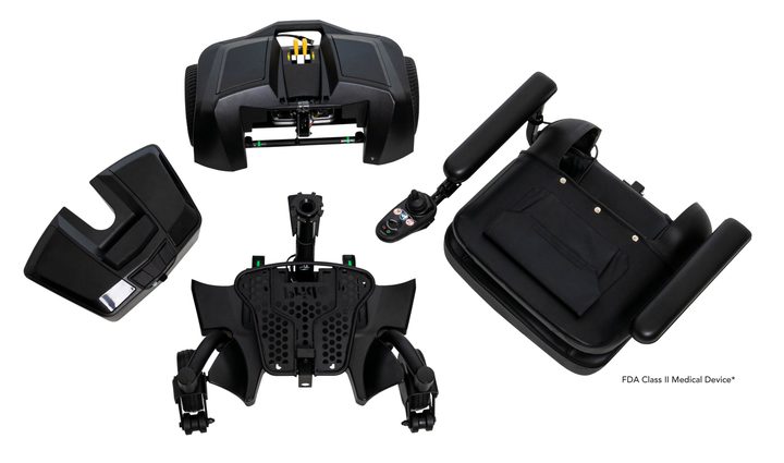 The same travel power chair broken down into five pieces — seat, base, batteries and armrests — laid out side by side.