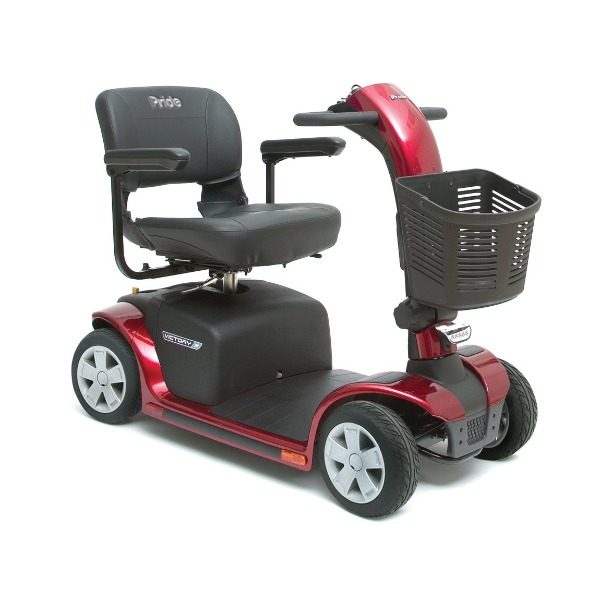 A four-wheel mobility scooter in candy-apple red with a front basket and tiller steering.